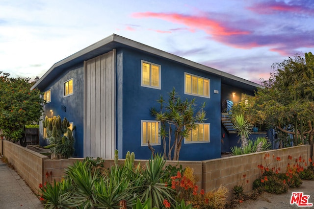 view of property exterior at dusk