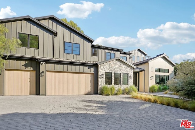 view of front of property with a garage