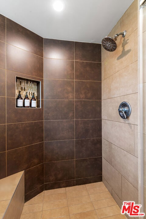 bathroom with a tile shower