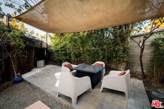 view of patio / terrace with an outdoor fire pit