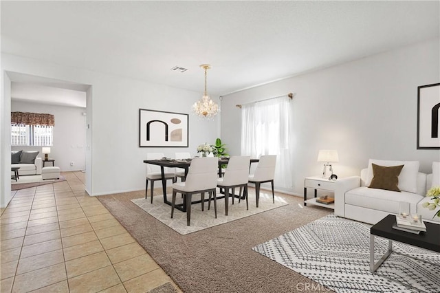 tiled living room featuring a chandelier