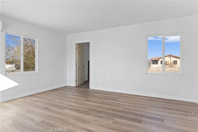 empty room with light hardwood / wood-style floors