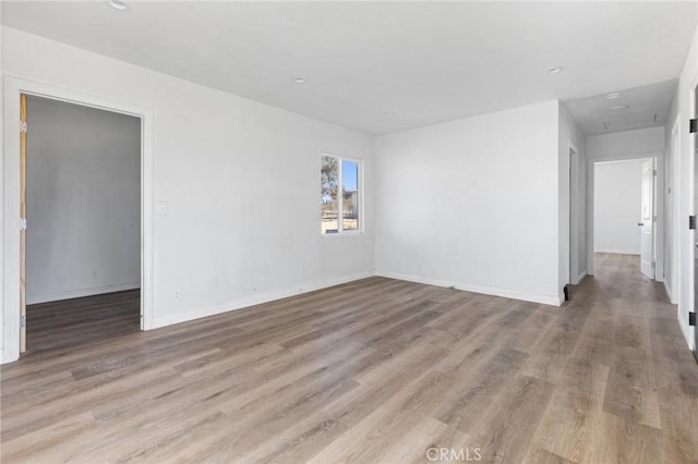 unfurnished room featuring light hardwood / wood-style flooring