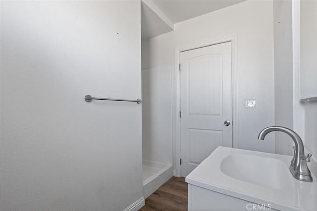 bathroom featuring hardwood / wood-style floors and vanity