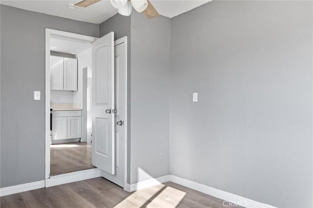 spare room featuring ceiling fan and hardwood / wood-style floors