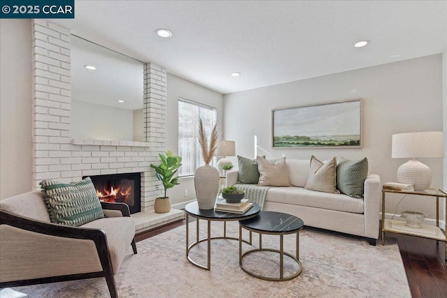 living room featuring hardwood / wood-style floors and a fireplace