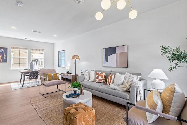 living room with light hardwood / wood-style flooring