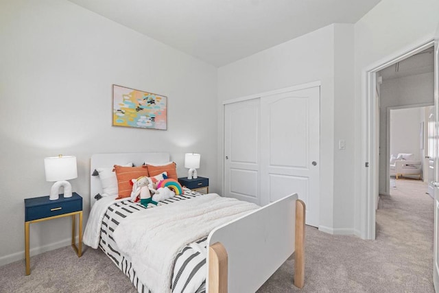 bedroom with a closet and carpet flooring