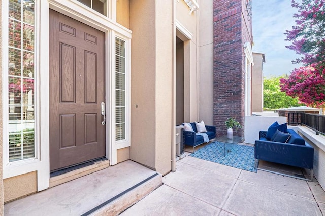 property entrance featuring an outdoor living space