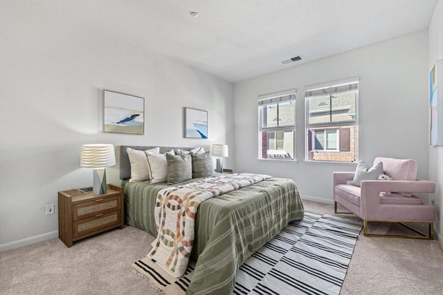 bedroom featuring light colored carpet