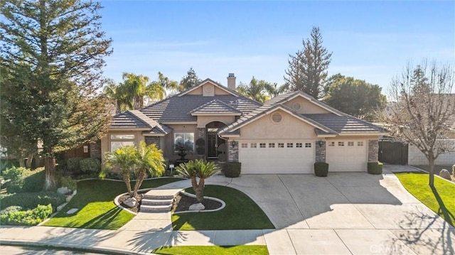 view of front of house with a front lawn and a garage