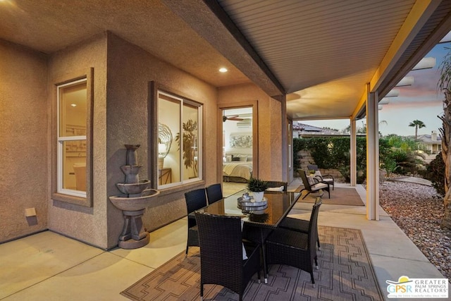 view of patio terrace at dusk