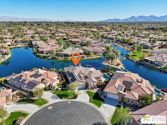 aerial view featuring a water and mountain view