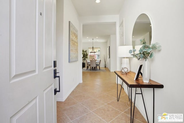 hall with light tile patterned floors