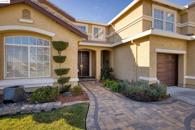 entrance to property featuring a garage