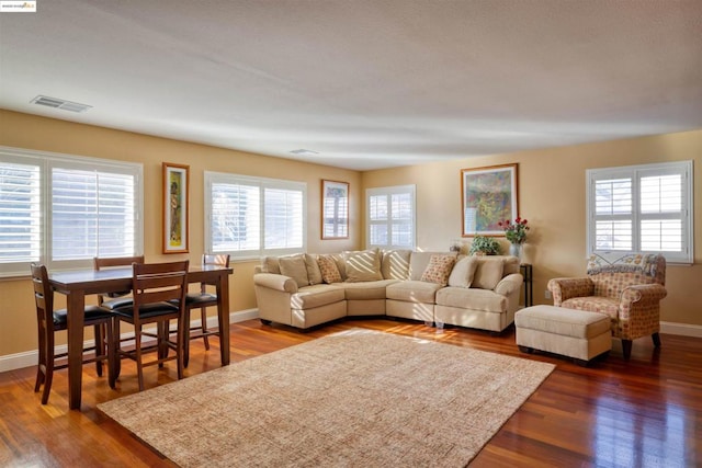 living room with dark hardwood / wood-style flooring