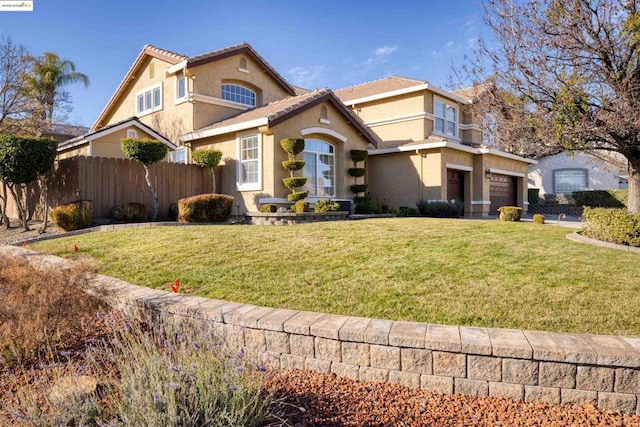 view of front of property with a front lawn and a garage