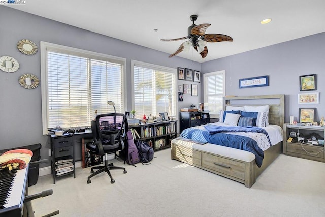 bedroom featuring ceiling fan and light colored carpet