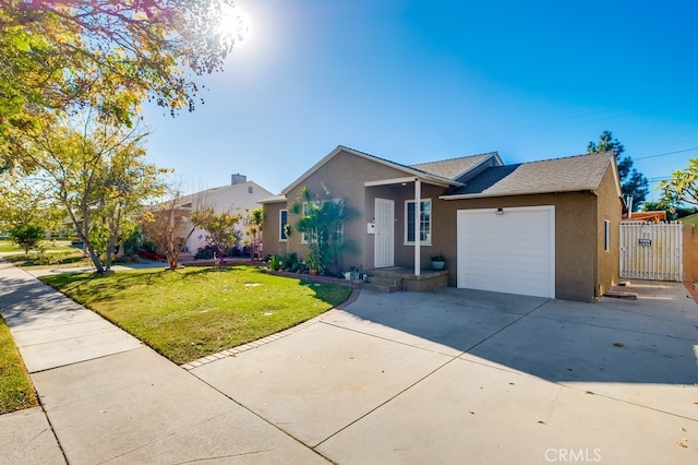 ranch-style house featuring a front yard and a garage