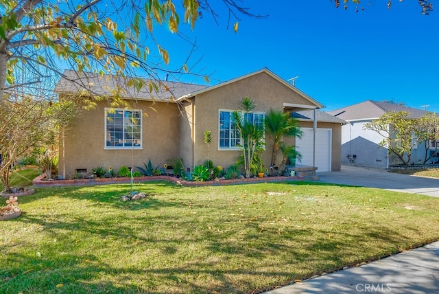 view of front of property featuring a garage and a front lawn