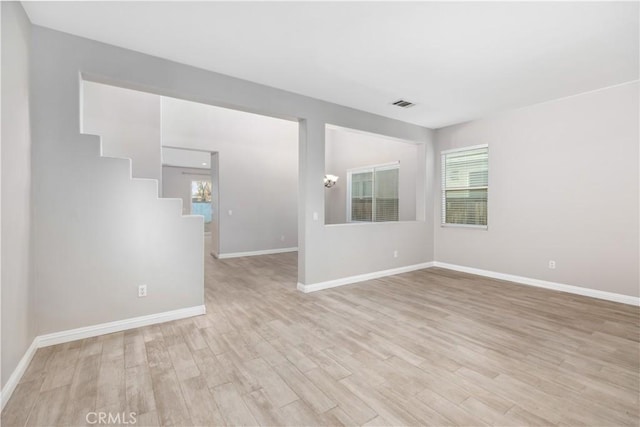 unfurnished room featuring light hardwood / wood-style flooring