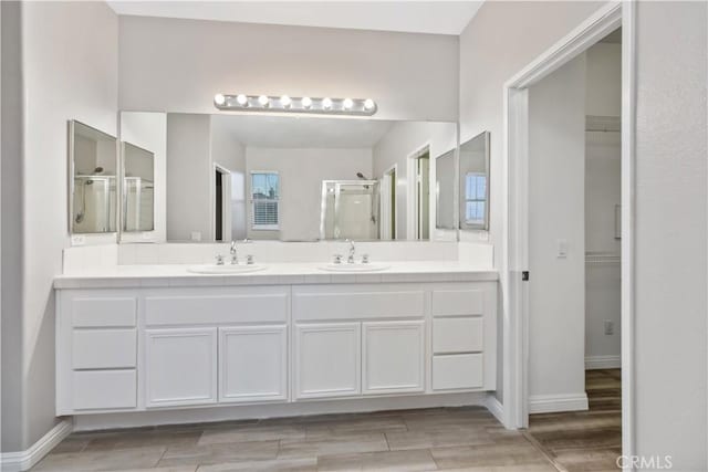 bathroom with vanity and walk in shower