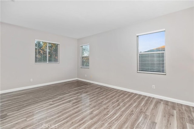 unfurnished room featuring light wood-type flooring