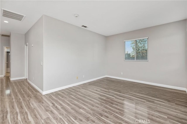 empty room with light wood-type flooring