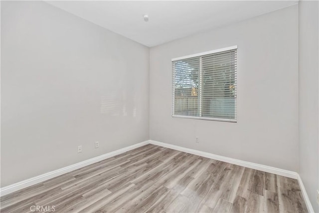 spare room with light wood-type flooring