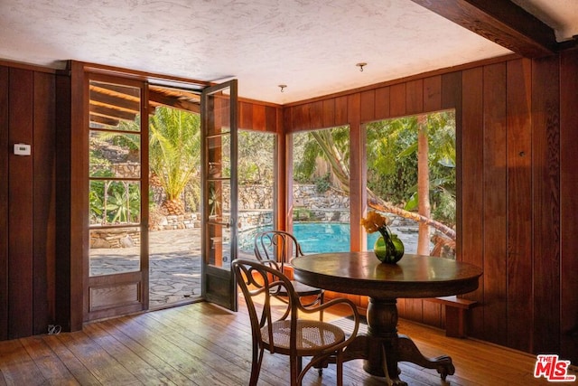 sunroom / solarium with beamed ceiling