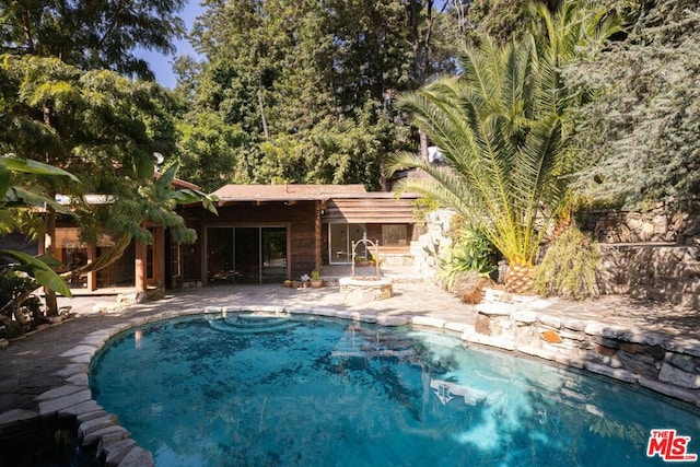 view of pool with a patio area