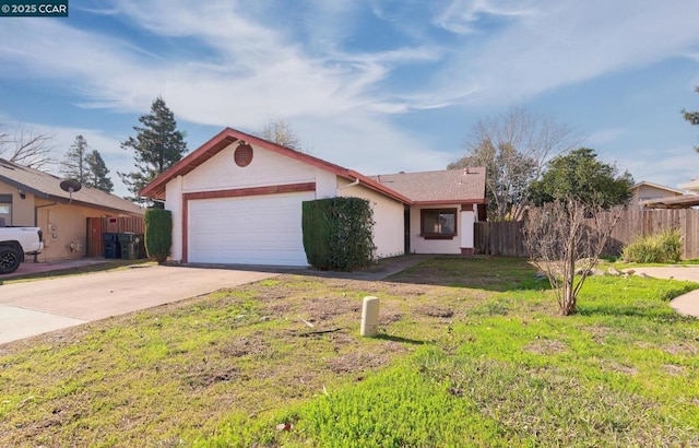 view of front of home featuring a front lawn and a garage