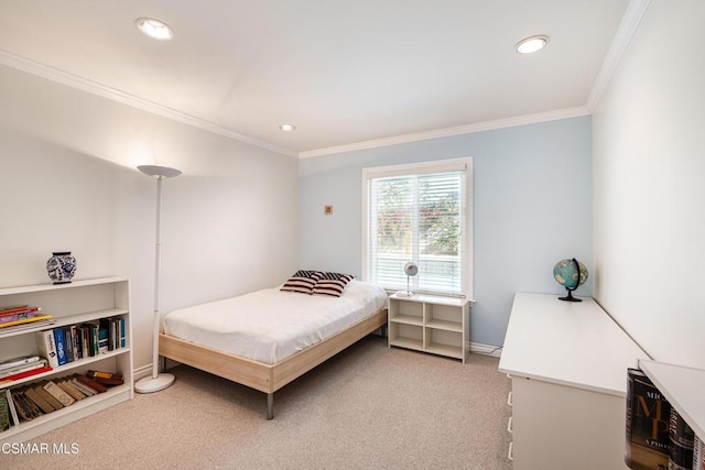 bedroom with light colored carpet and crown molding