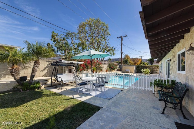 view of pool featuring a patio area and a lawn