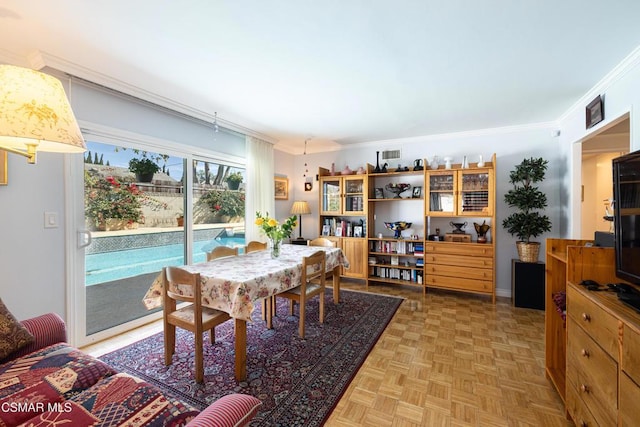 dining room with light parquet floors and ornamental molding