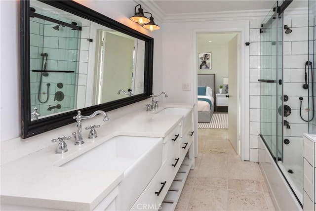 bathroom with combined bath / shower with glass door, vanity, and crown molding