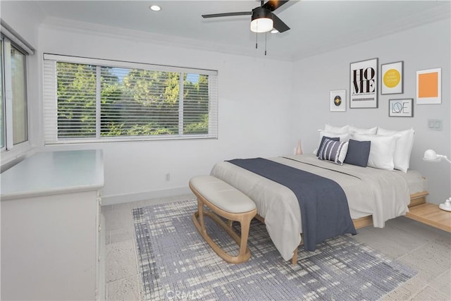 bedroom featuring ceiling fan and crown molding