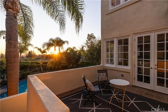 balcony at dusk with french doors