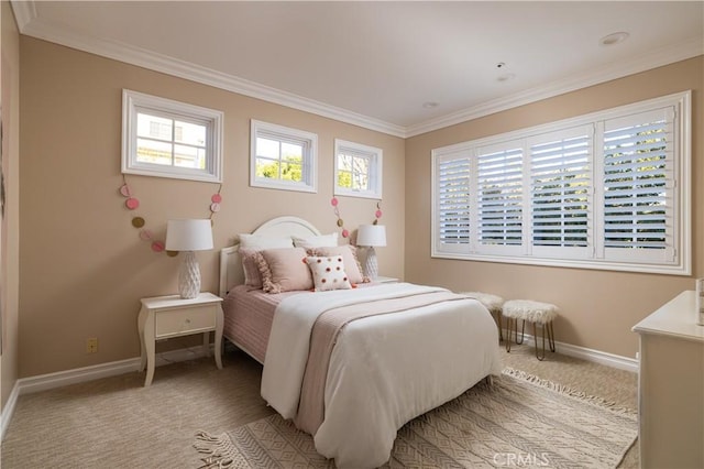 carpeted bedroom featuring crown molding