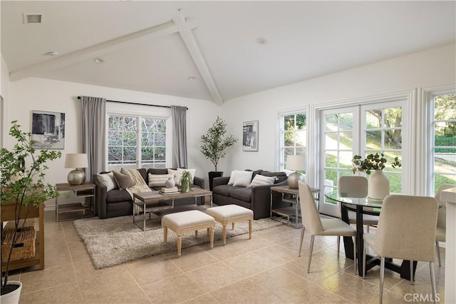 tiled living room featuring vaulted ceiling with beams and a wealth of natural light