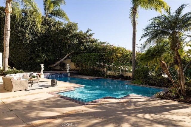 view of swimming pool featuring a patio