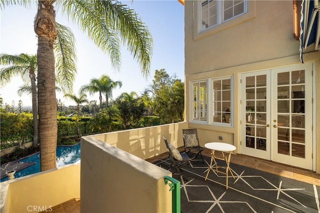 balcony featuring french doors