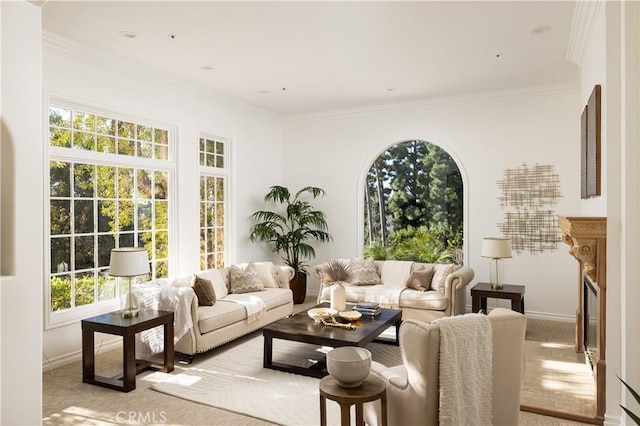 living room featuring a premium fireplace, light carpet, and crown molding