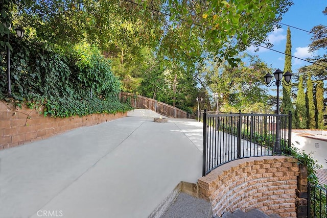 view of gate with a patio area