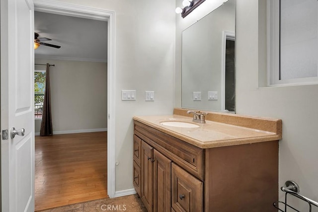 bathroom featuring ceiling fan, crown molding, tile patterned floors, and vanity