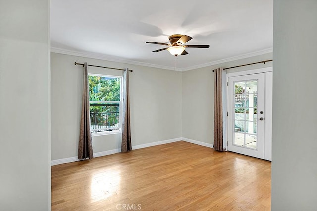 spare room with ceiling fan, light hardwood / wood-style flooring, and crown molding