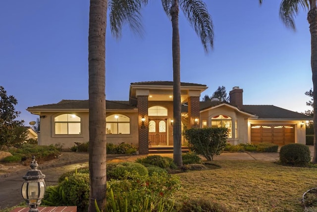 mediterranean / spanish house featuring a garage