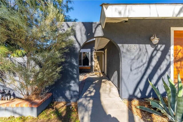 view of side of property with a patio area