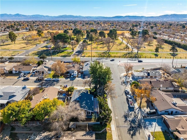 birds eye view of property featuring a mountain view