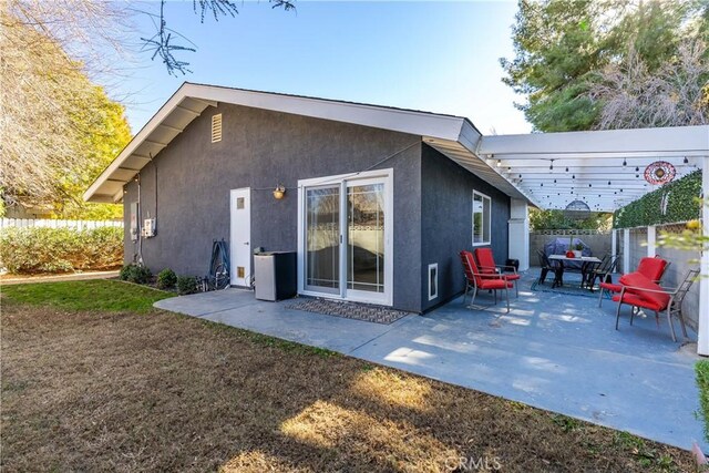 back of house with a patio